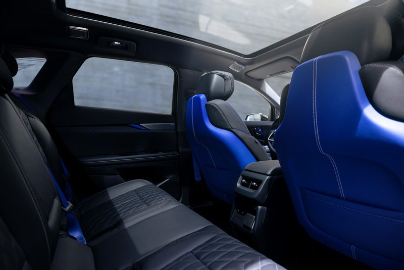 Back Seat View of the 2026 OPTIQ-V Blue Front Seats, Sun Roof, and Interior | Gilleland Cadillac in St Cloud MN